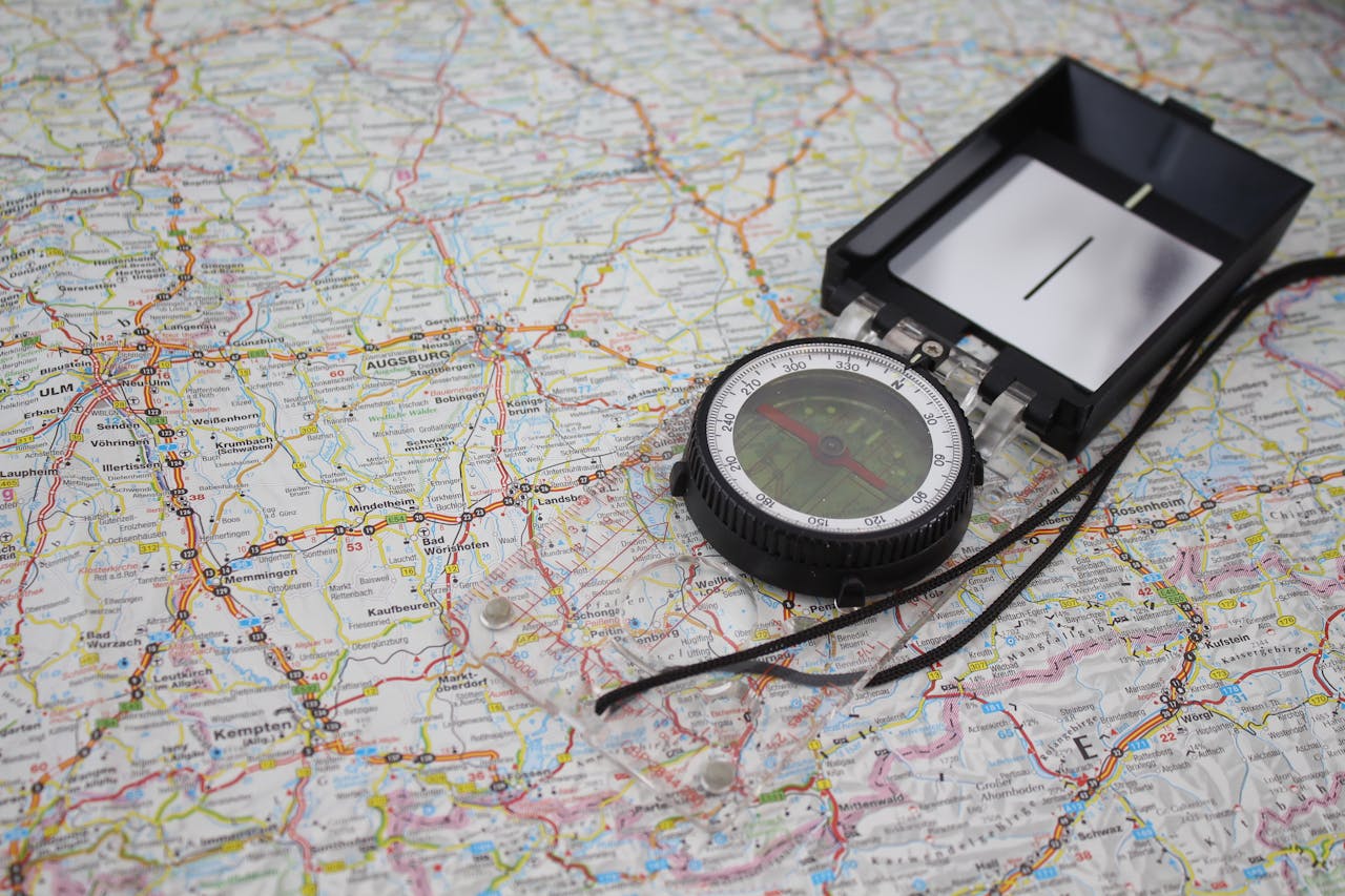 Close-up of a compass on a detailed map of Germany, ideal for travel and navigation themes.